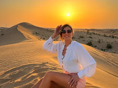 Guest enjoying the sunset on the red dunes